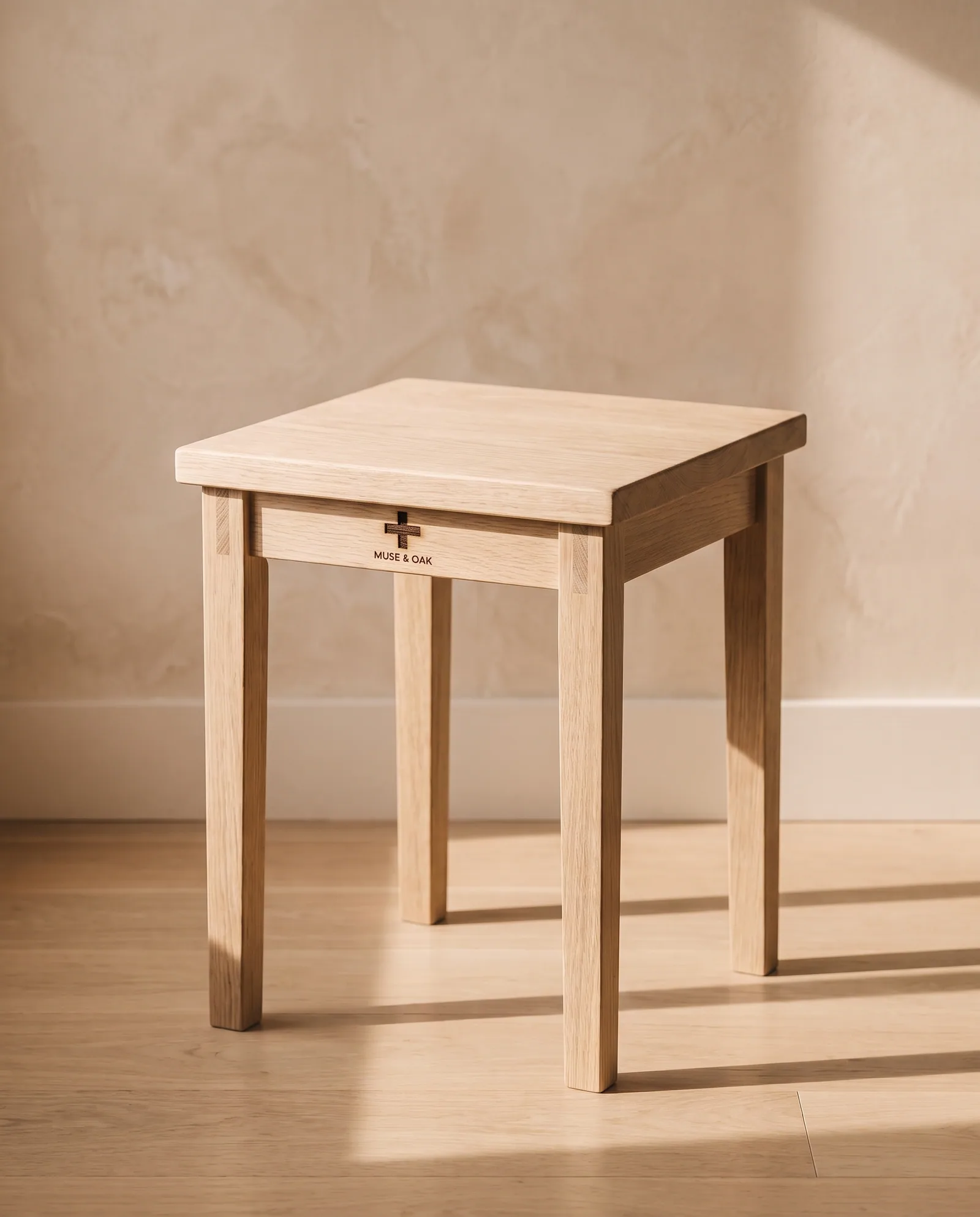 A solid white oak lap stool in daylight