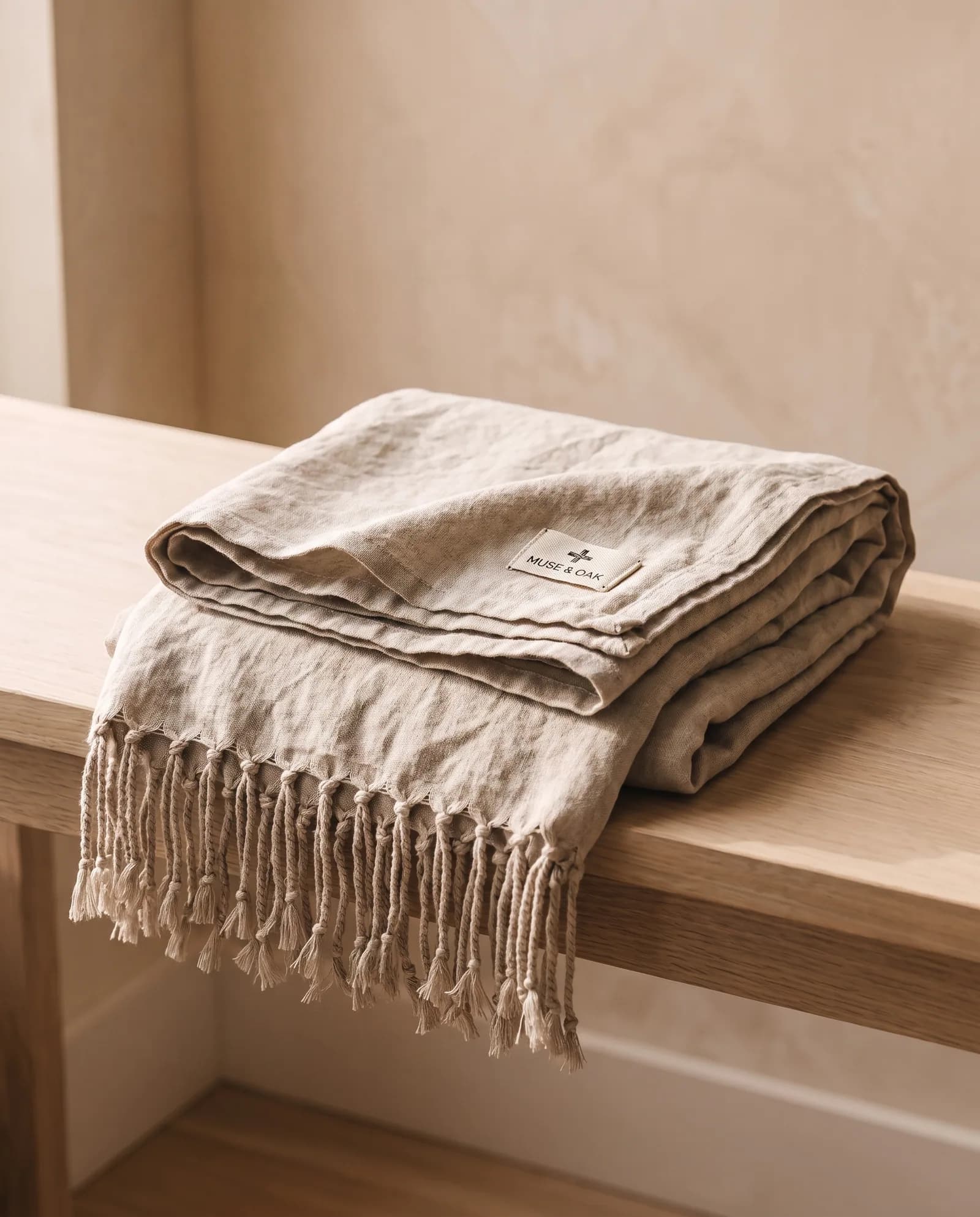 Linen Throw — Stonewashed, hand-knotted fringe.